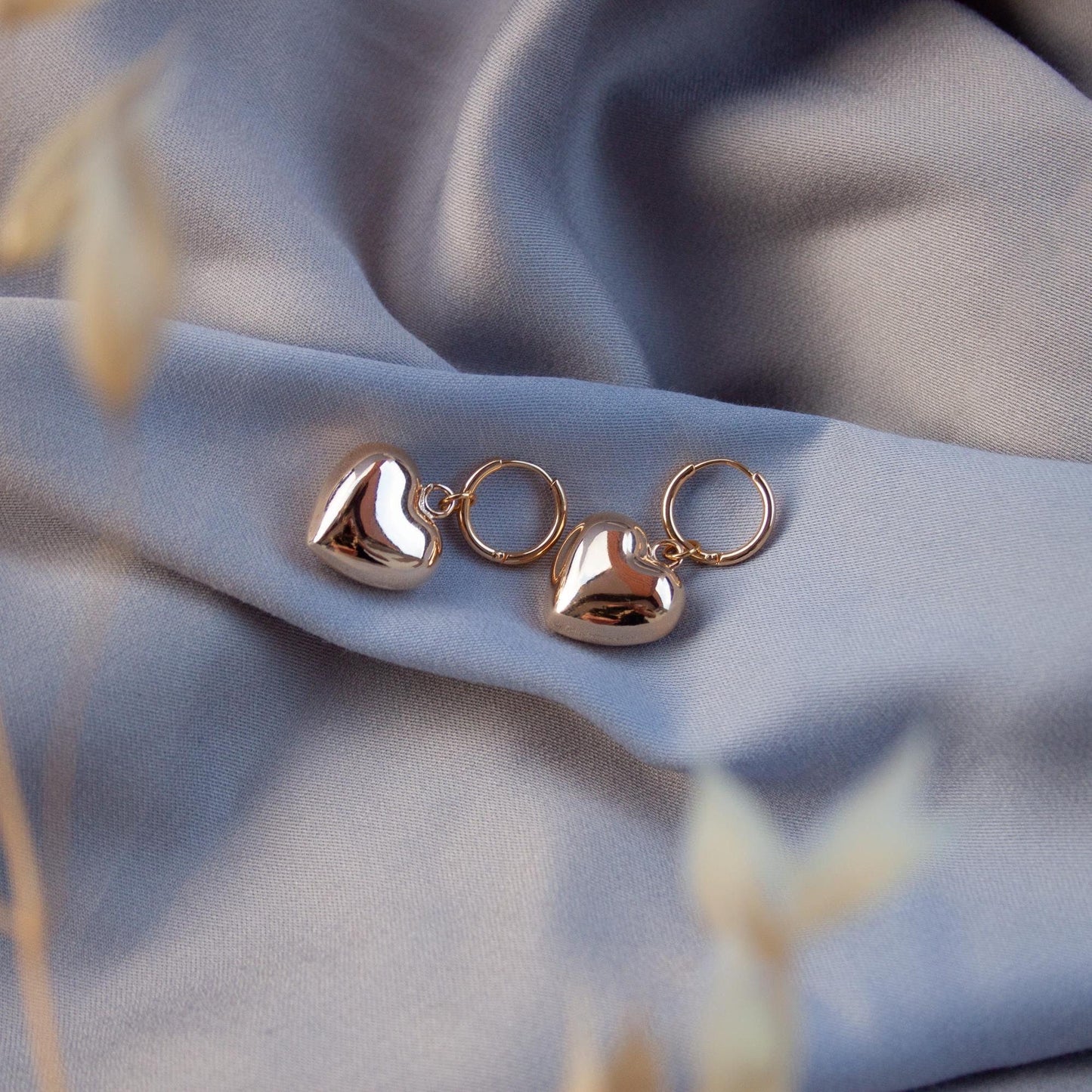 Gold puffy heart hoop earrings