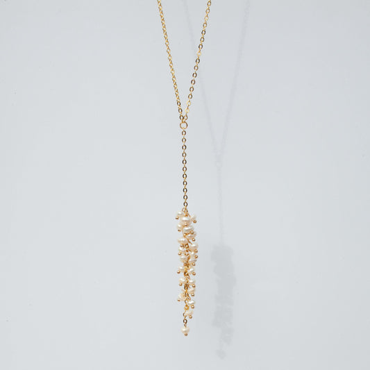 Long gold lariat necklace with clustered freshwater pearls